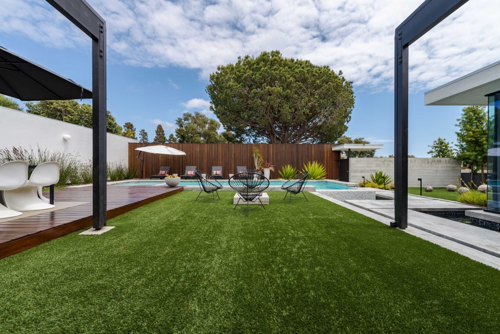 Stylish backyard with artificial turf
